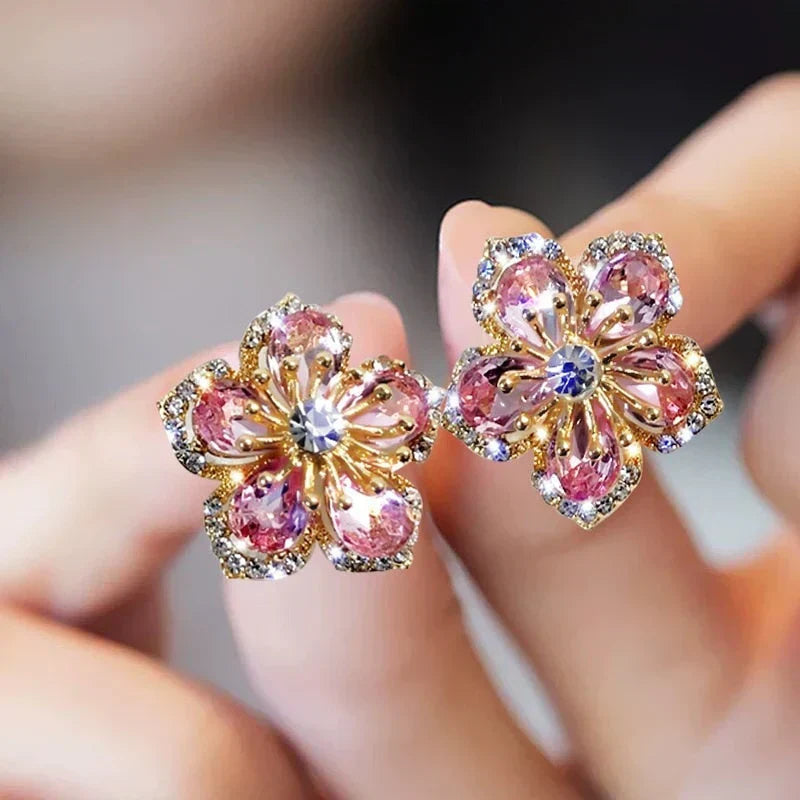 Pendientes con forma de flor de circonitas rosas brillantes y diseño radiante