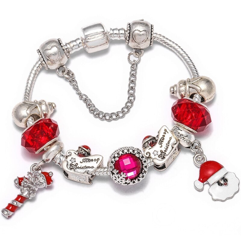 Pulsera navideña festiva con cristales rojos y figuras de Papá Noel