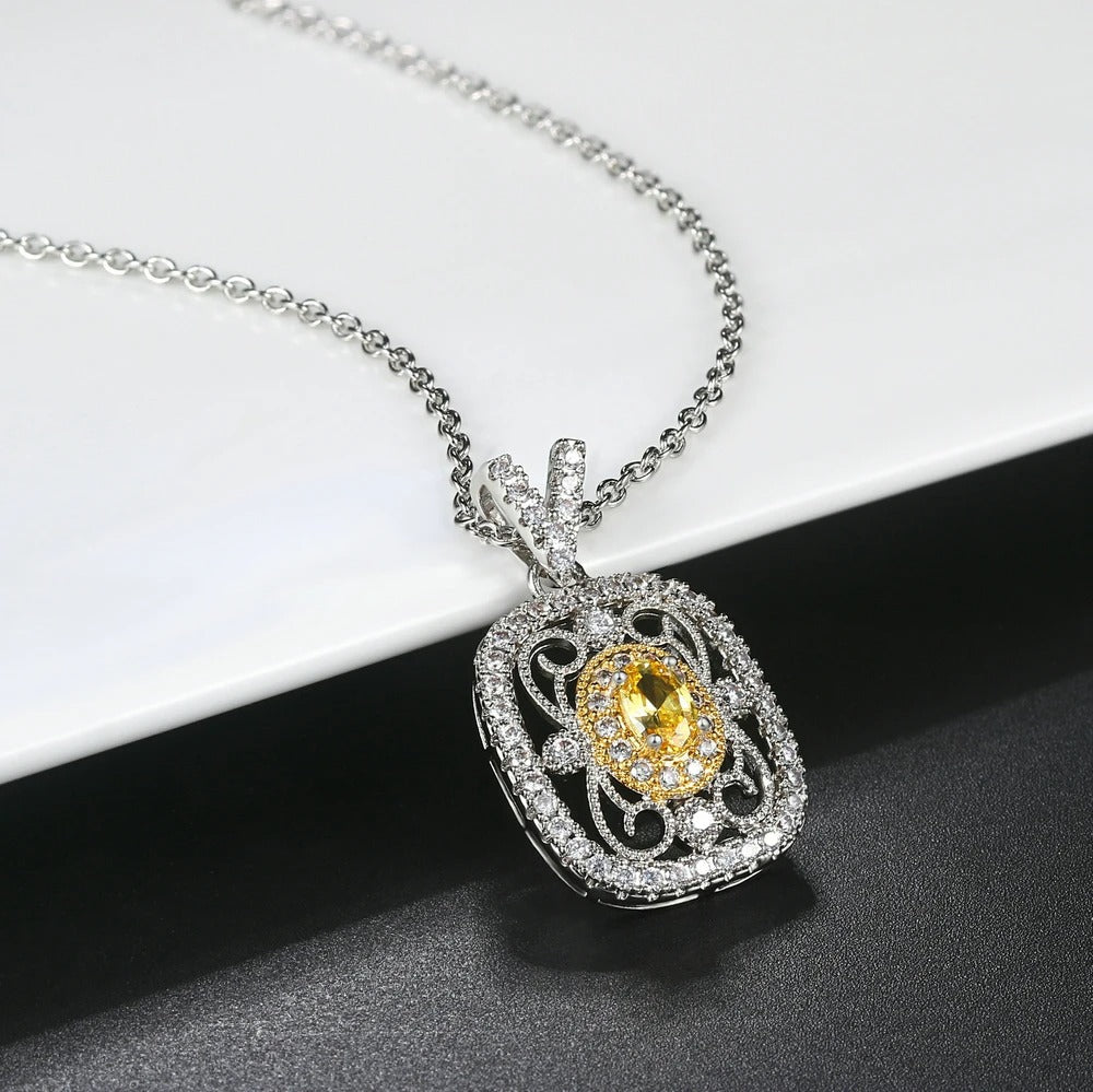 Elegante colgante con piedra preciosa amarilla y brillantes cristales de circonita