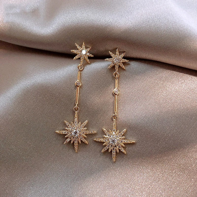Pendientes brillantes de cristal de polvo de estrellas con un elegante estilo vintage