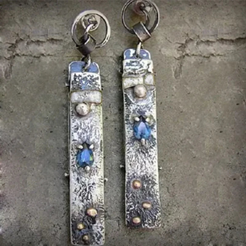 Pendientes largos rústicos hechos a mano con piedras azules