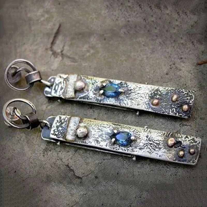 Pendientes largos rústicos hechos a mano con piedras azules
