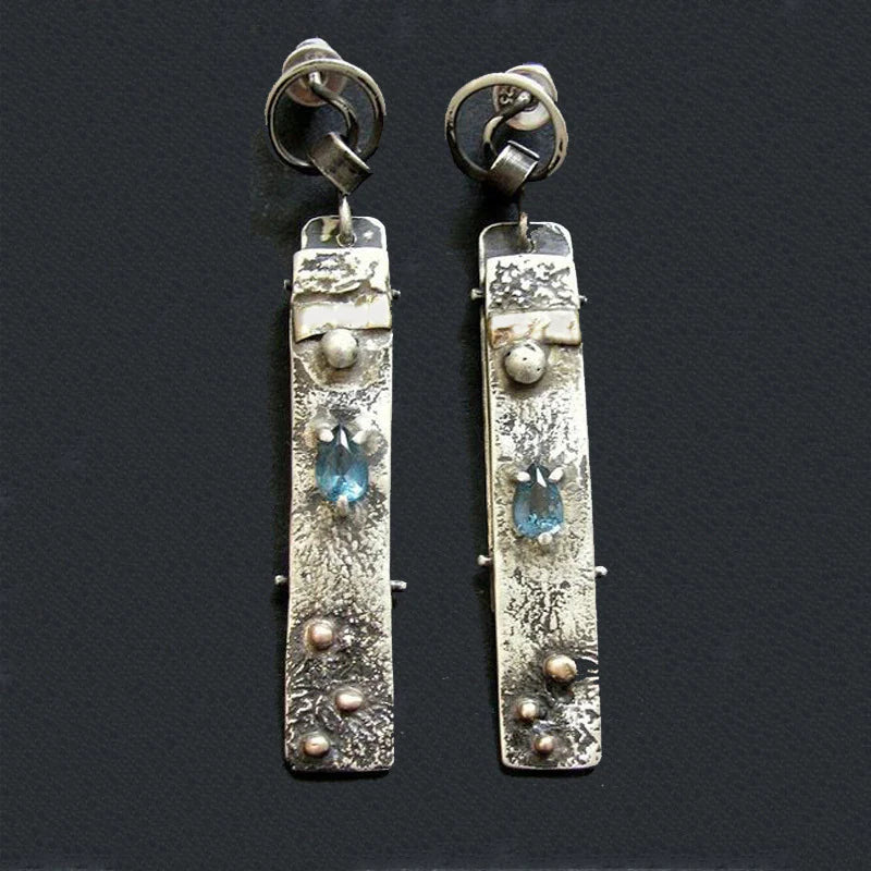 Pendientes largos rústicos hechos a mano con piedras azules