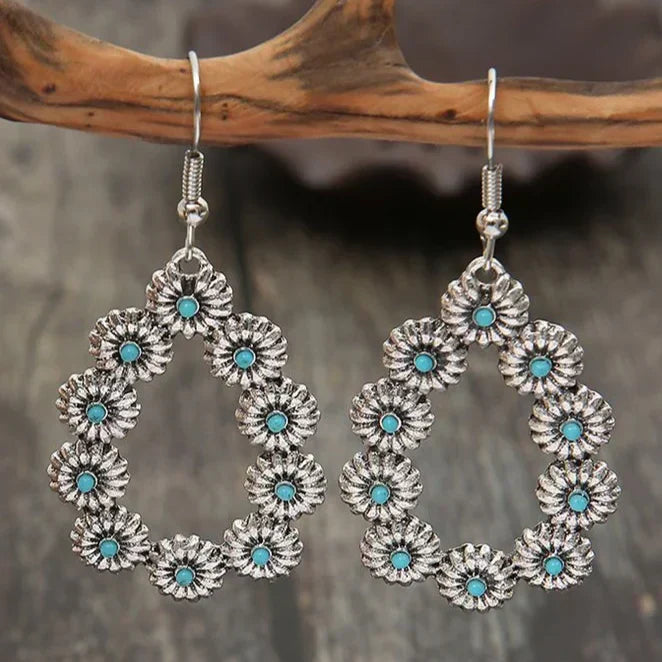 Pendientes colgantes antiguos con flores azul turquesa para un estilo occidental