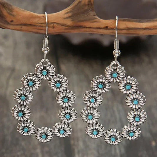 Pendientes colgantes antiguos con flores azul turquesa para un estilo occidental