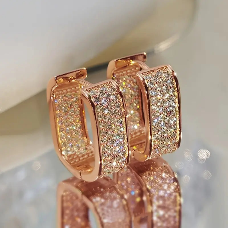 Pendientes brillantes en forma de U con diseño de pavé de cristal brillante