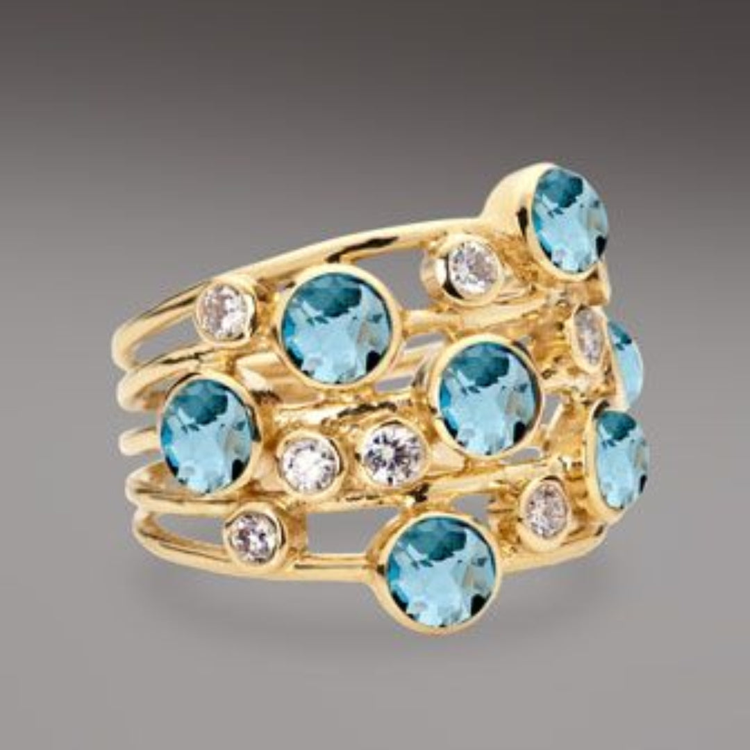 Anillo vintage de oro con circonitas azules y blancas