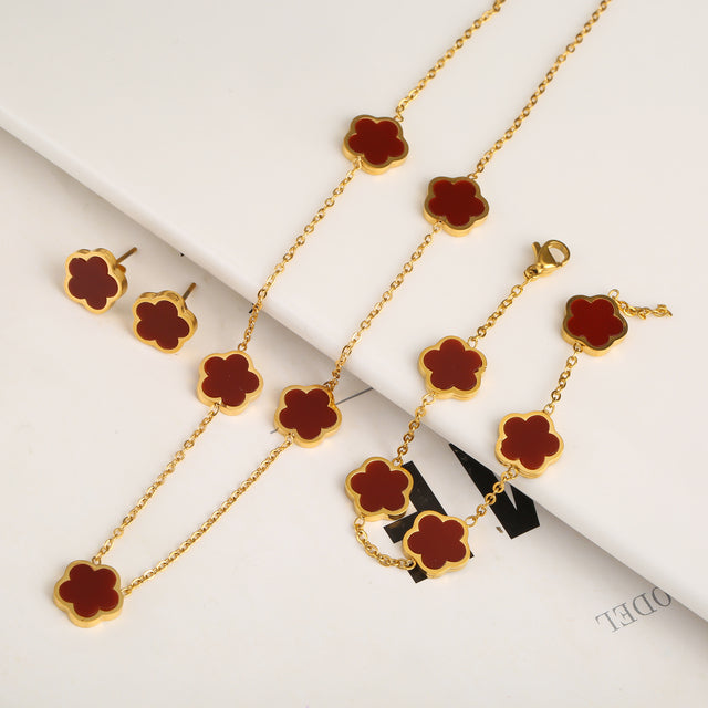 Elegante conjunto de joyas en forma de trébol con incrustaciones de piedras de colores