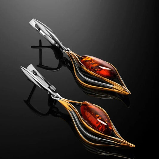 Pendientes elegantes con ámbar brillante y diseño ondulado