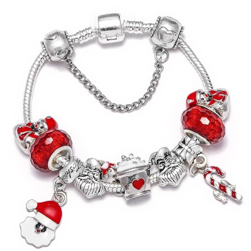 Pulsera navideña festiva con cristales rojos y figuras de Papá Noel