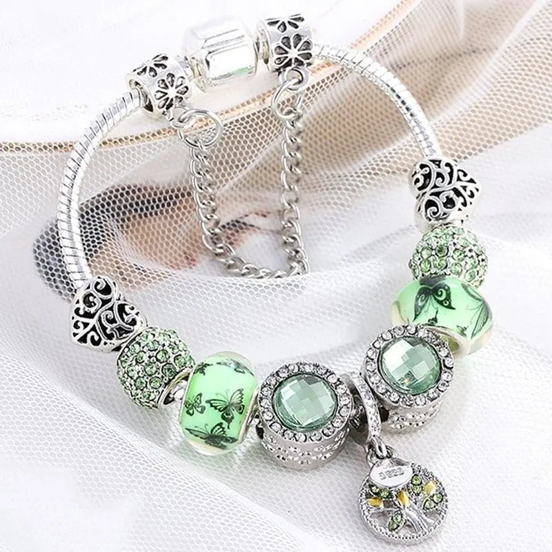 Pulsera con dos brillantes con cristales verdes y deliciosas mariposas