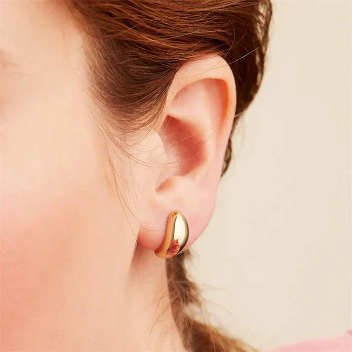 Pendientes colgantes de metal achaparrados de estilo moderno