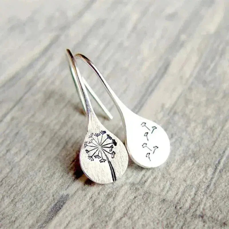Elegantes pendientes de diente de león con encantador motivo de semillas