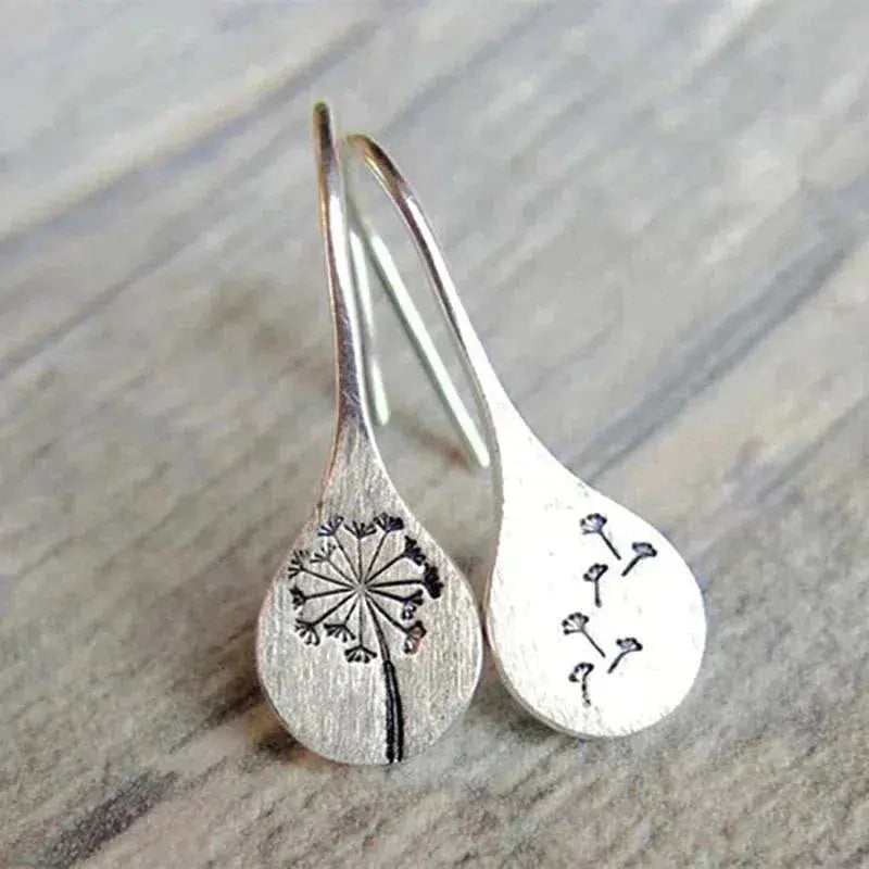 Elegantes pendientes de diente de león con encantador motivo de semillas