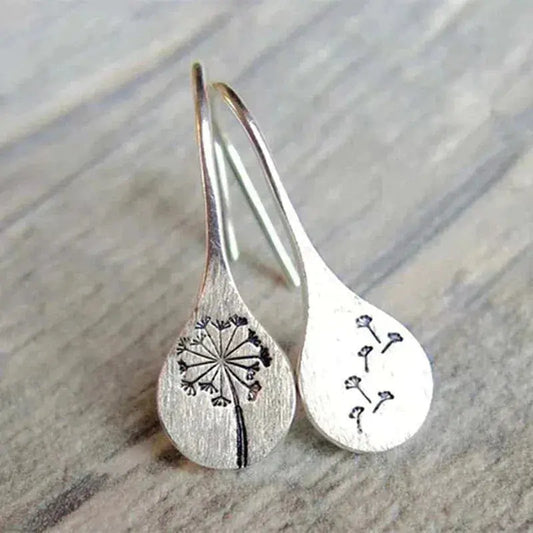 Elegantes pendientes de diente de león con encantador motivo de semillas