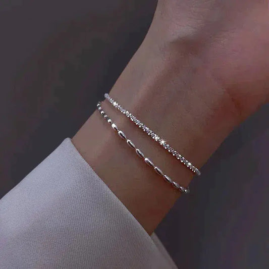 Glamorosa pulsera de circonitas con elegante collar de perlas