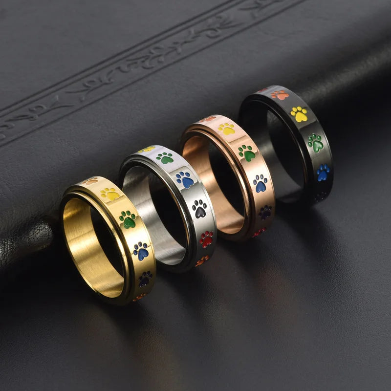 Anillo giratorio para reducción de estrés - Acero inoxidable con patas arcoíris