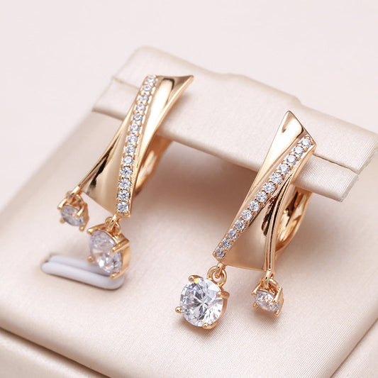 Pendientes de circonitas brillantes con elegante aspecto dorado y cierre desplegable