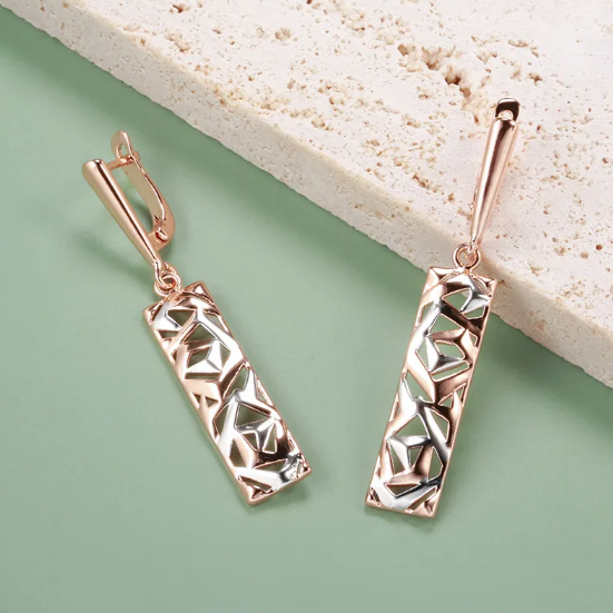 Pendientes bicolores con motivo geométrico calado con aspecto de oro rosa