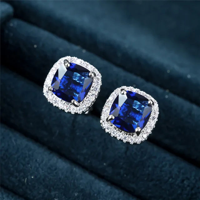 Elegantes pendientes de zafiro con halo de circonita cúbica de talla cojín