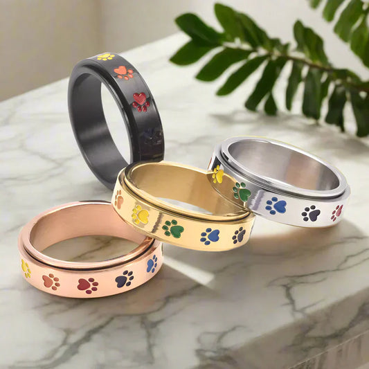 Anillo giratorio para reducción de estrés - Acero inoxidable con patas arcoíris