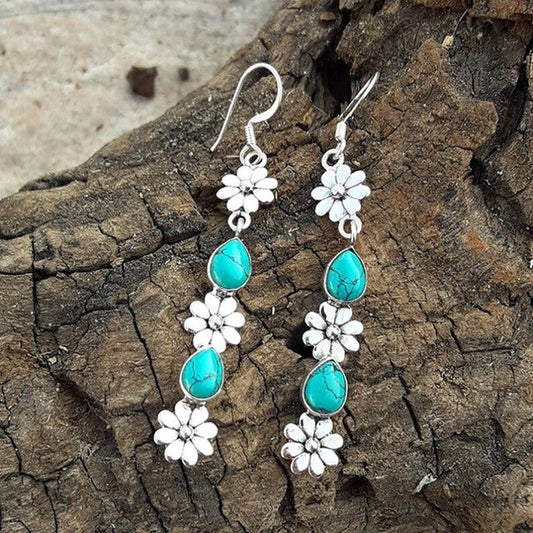Pendientes de piedras preciosas turquesas con adornos florales