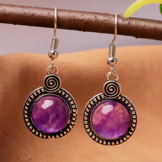 Pendientes vintage con cristal morado y detalles en espiral