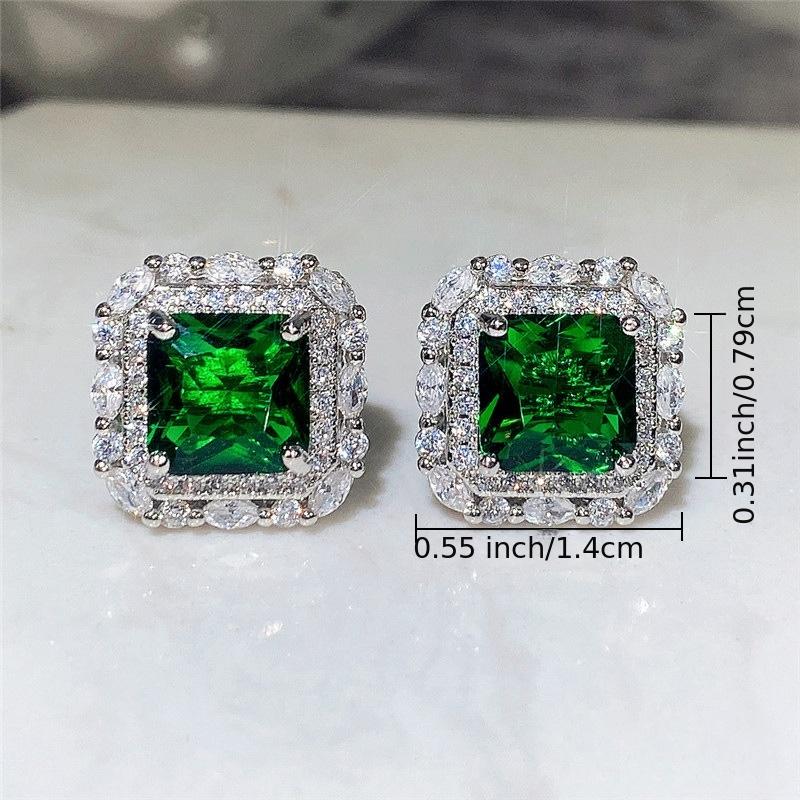 Elegantes pendientes de circonita verde esmeralda con montura brillante