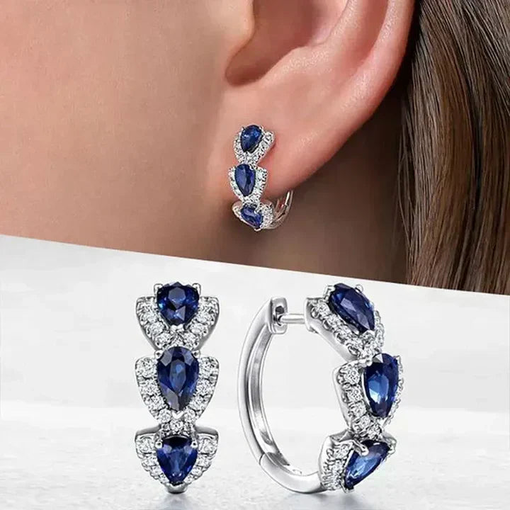 Pendientes elegantes con gotas de zafiro azul y circonitas brillantes