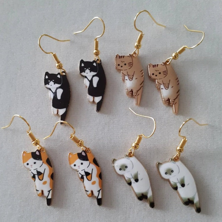 Lindos pendientes de gato de dibujos animados con un divertido diseño colgante