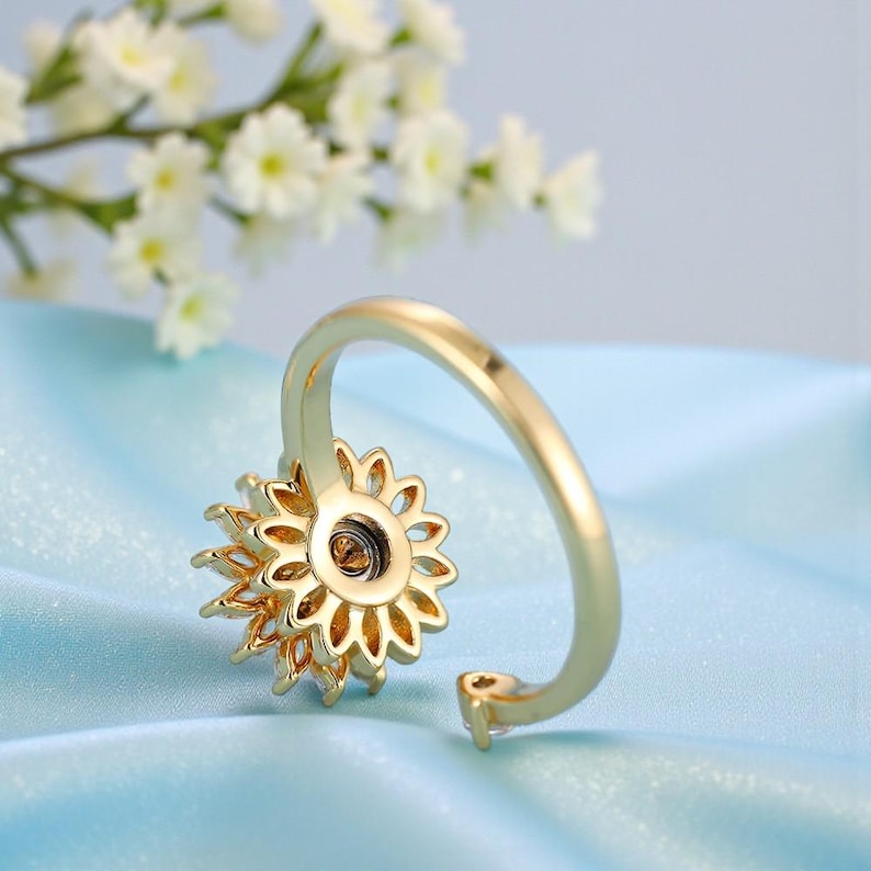 Anillo Inés giratorio flores acero inoxidable - Sparkano