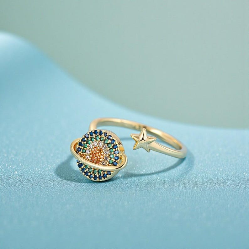 Anillo giratorio Áurea planeta ajustable - Sparkano Marbella