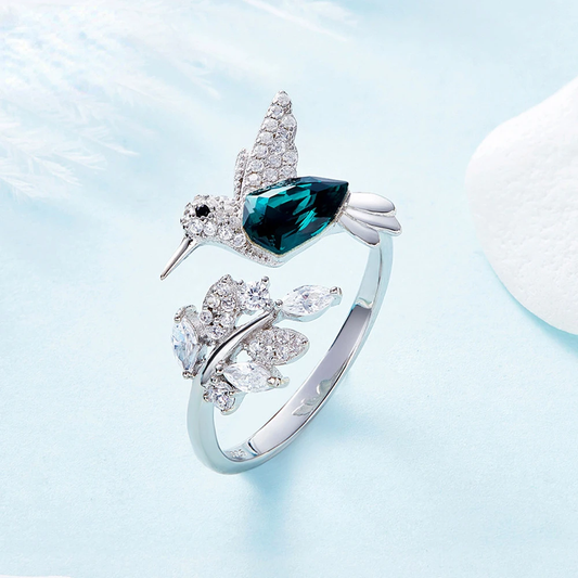 Anillo ajustable con pájaros y circonita azul