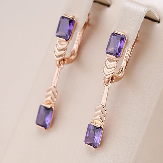Pendientes con cristales morados y acabado en color rosa
