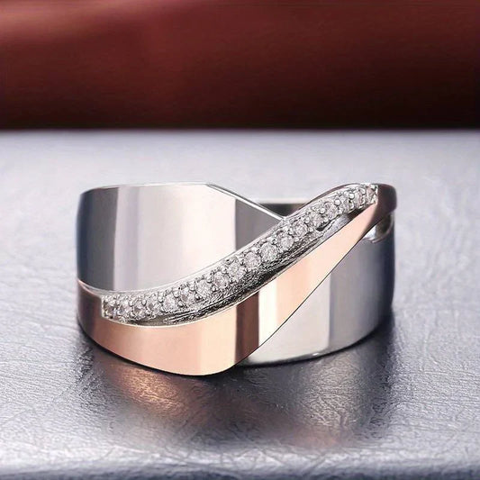 Anillo bicolor de acero con circonitas