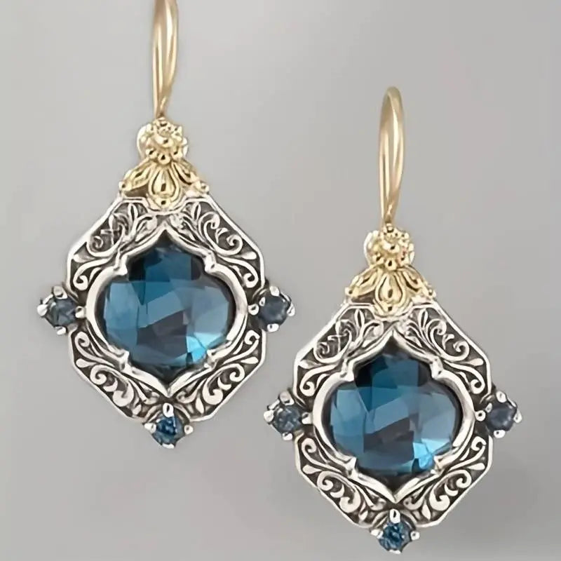 Pendientes antiguos de topacio azul con diseño floral vintage