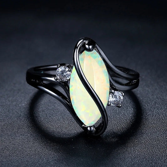 Anillo vintage negro con ópalo plateado
