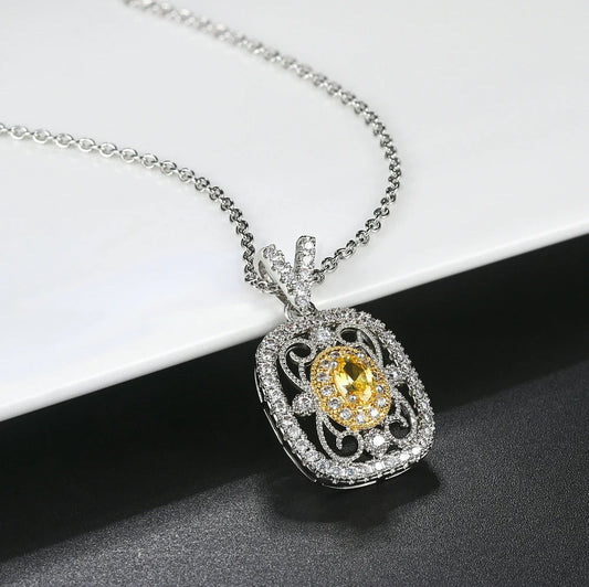 Elegante colgante con piedra preciosa amarilla y brillantes cristales de circonita