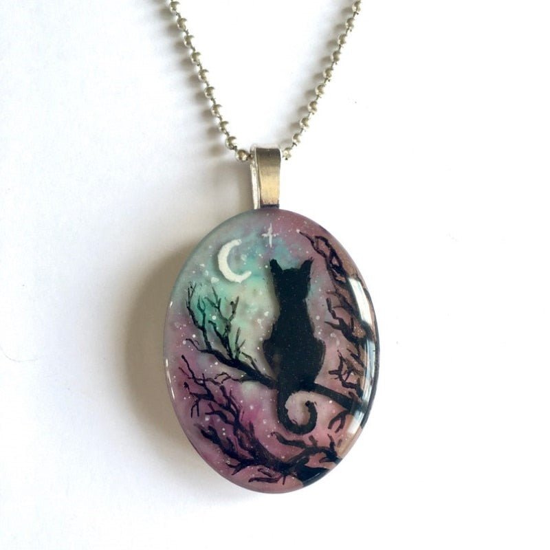 Collar de gato de ensueño con brillante cielo nocturno y colgante de luna